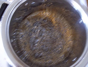 boiling coffee syrup for coffee glazed bacon recipe at Talk About Coffee