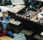 Diverse coffee shop customers representing different personality types and behaviors in typical café setting, illustrating coffee culture stereotypes