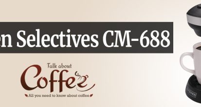 Black Kitchen Selectives CM-688 single serve coffee maker brewing directly into a white mug