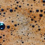 Macro closeup of espresso crema with visible bubbles