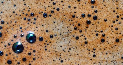 Macro closeup of espresso crema with visible bubbles