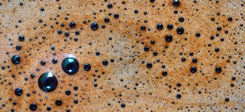Macro closeup of espresso crema with visible bubbles