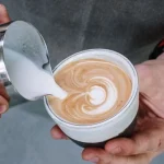 ilk being poured into a cup of coffee