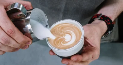 ilk being poured into a cup of coffee