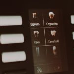Touchscreen display on a super-automatic espresso machine showing drink selection icons