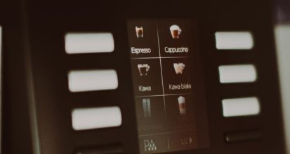 Touchscreen display on a super-automatic espresso machine showing drink selection icons