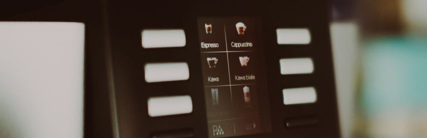 Touchscreen display on a super-automatic espresso machine showing drink selection icons