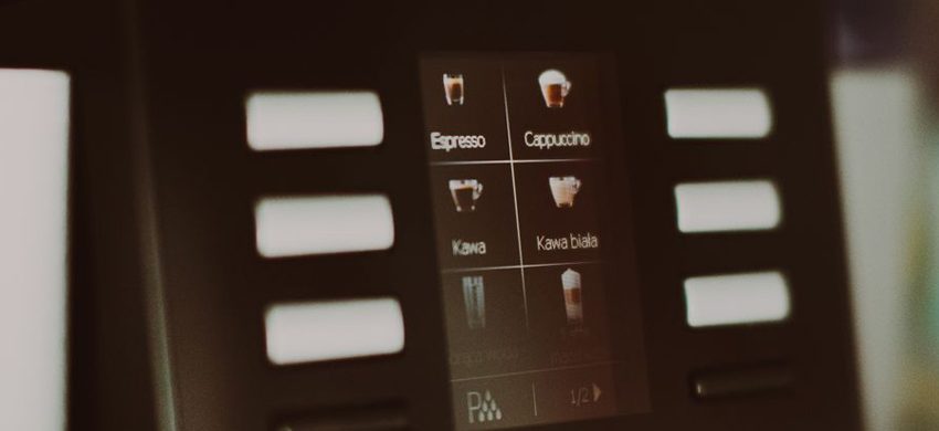 Touchscreen display on a super-automatic espresso machine showing drink selection icons