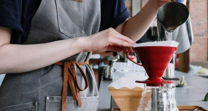 pouring water into coffee maker