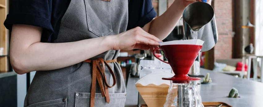 pouring water into coffee maker