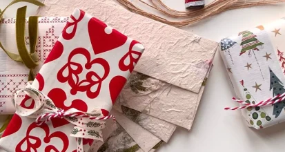 Wrapped Christmas gifts on a table for a white elephant or Secret Santa coffee gift exchange